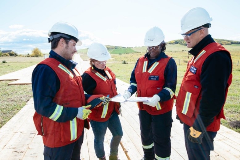 Figure 6 – CER Inspectors reviewing a map along a right-of-way.