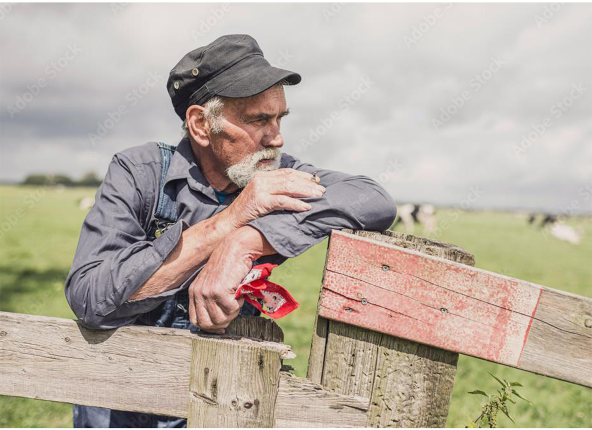 Figure 5 – Farmer looking out into the distance.