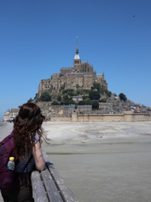 Before 2020 and the ongoing pandemic, Kelly loved to travel. She is looking forward to travelling again when it is safe to do so and wishes the same for her colleagues. In this photo, Kelly is looking out to the stunning view of Mont-Saint-Michel in France, which was taken during a backpacking trip.