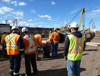 Group of CER inspectors at a pipeline construction site