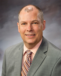 Peter Watson - président et premier dirigeant