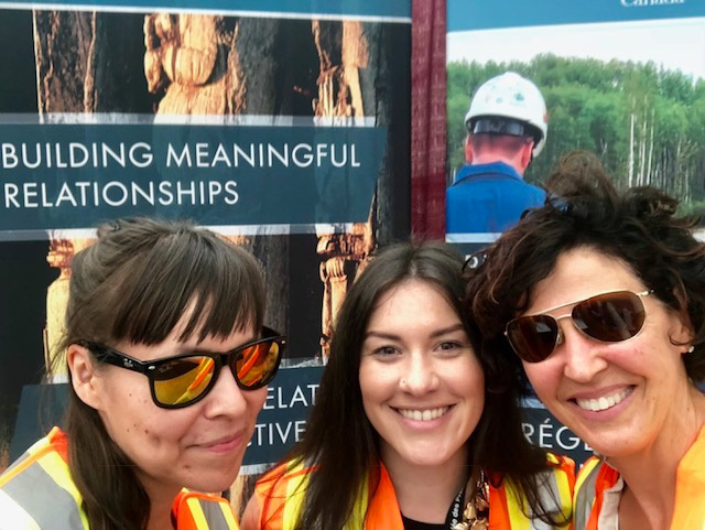 Three NEB engagement staff at a public event