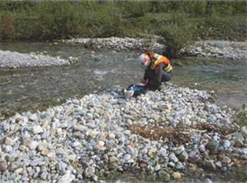 Inspector collecting a water sample