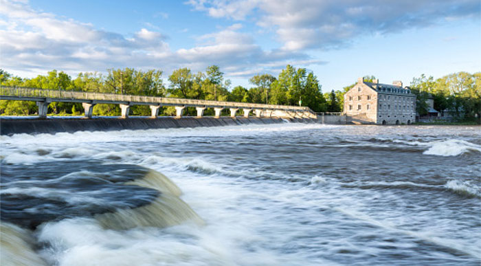 Historical dam site of Ile Des Moulins in the city of Terrebonne, Quebec on a nice summer day