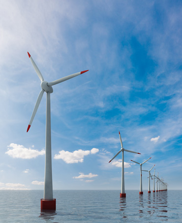 Wind turbines in the ocean on a sunny day