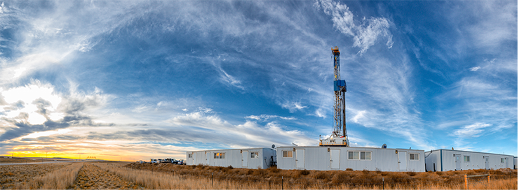 A panorama shot of a drilling rig early in the day under a dramatic sky in North Dakota, U.S.