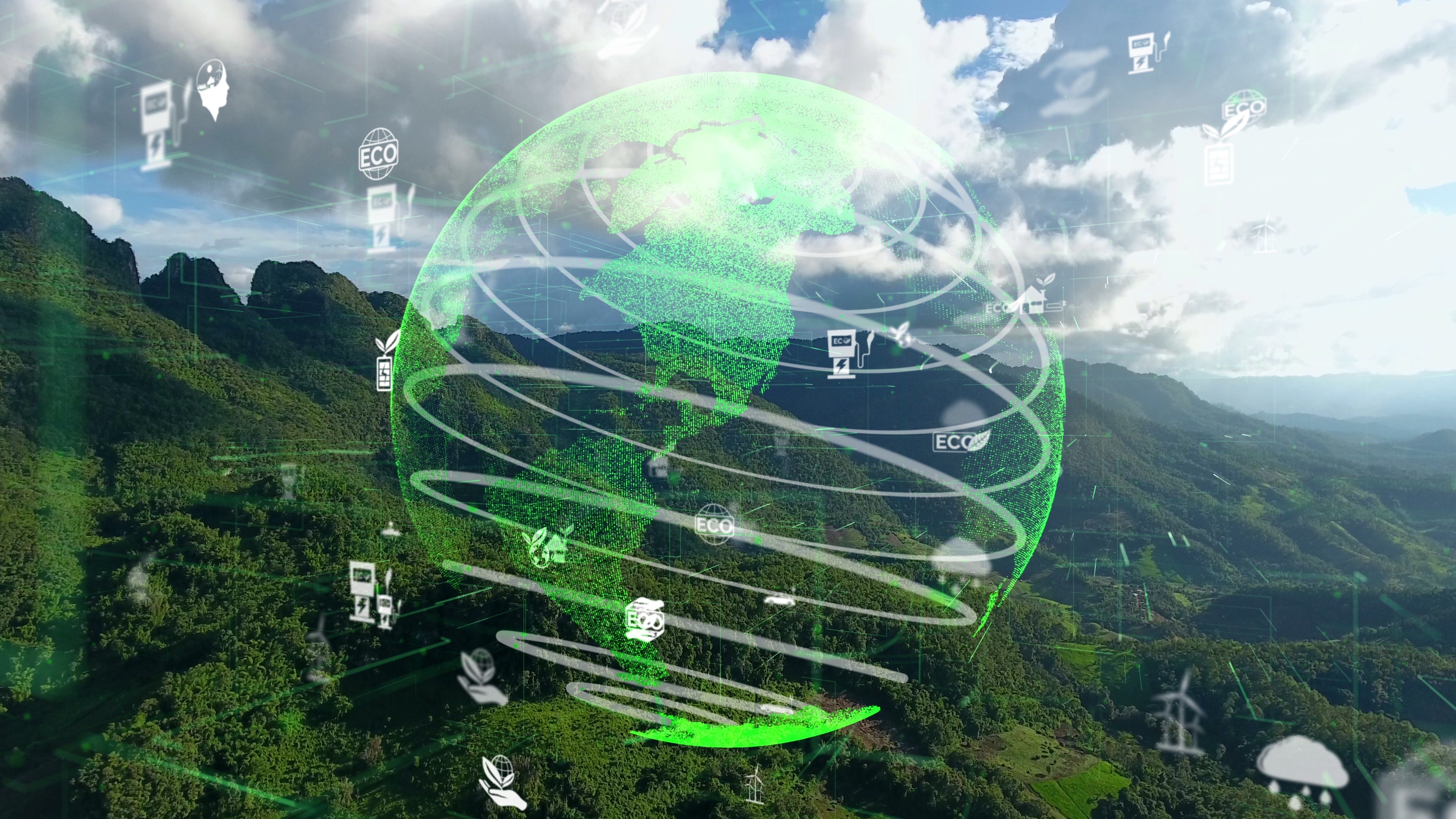 Transparent globe imposed over green, mountainous image, with small symbols representing renewable energy.