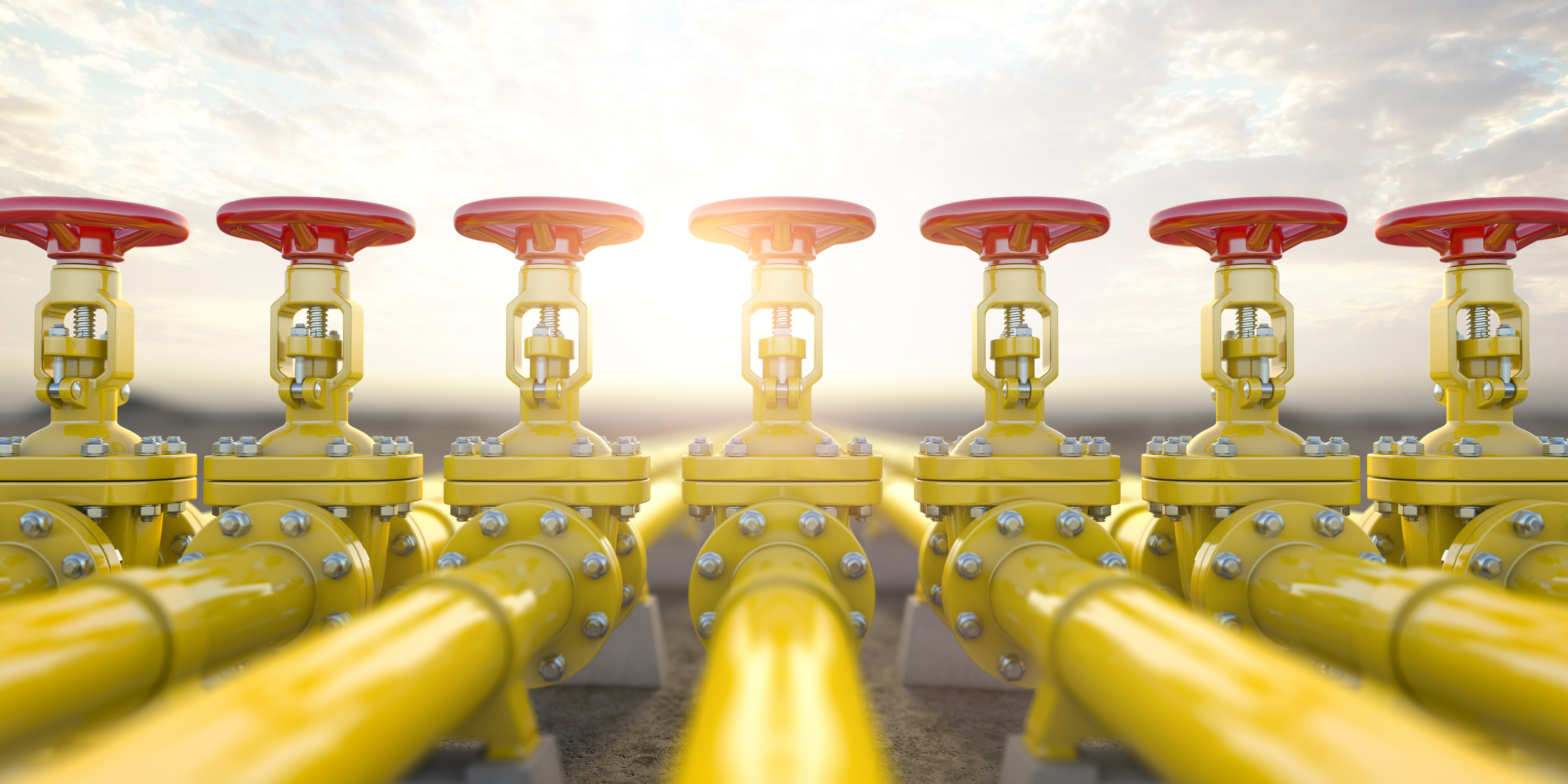 Yellow gas pipeline valves with blurry background.
