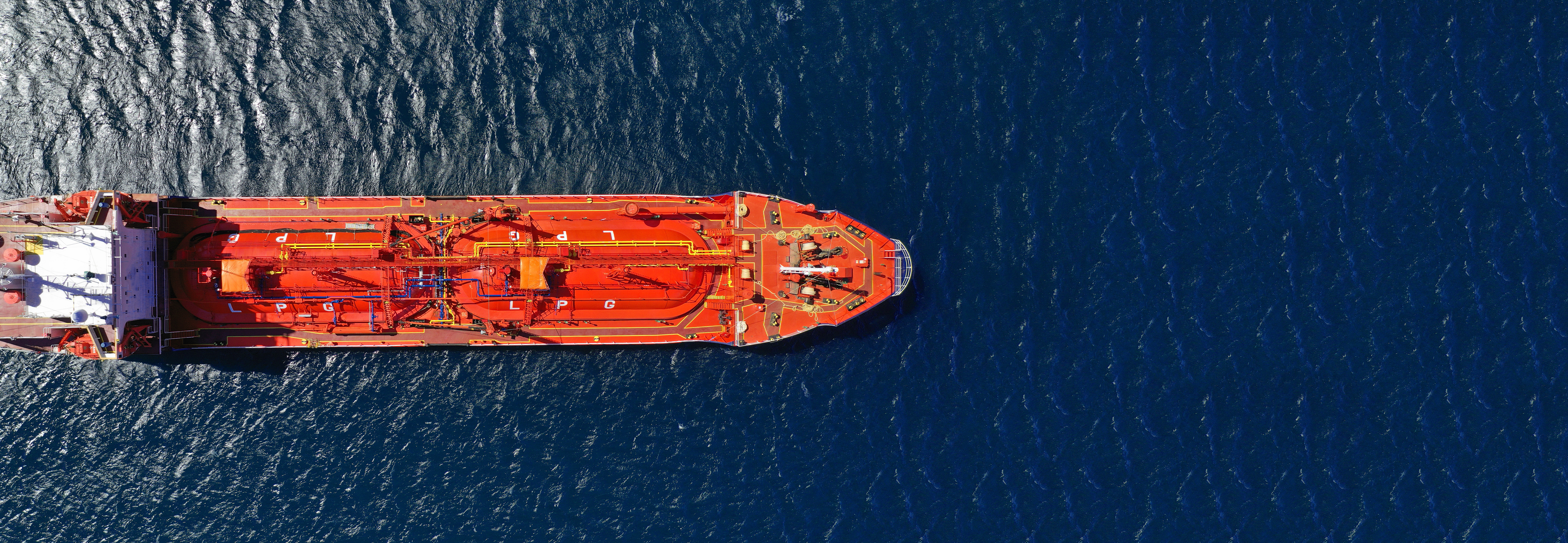 Liquid petroleum gas (LPG) sails on the ocean at midday.